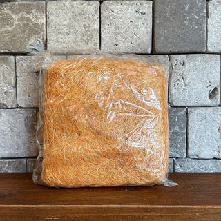 Decorative coco fiber for covering plant pot soil and enhancing indoor plant displays.