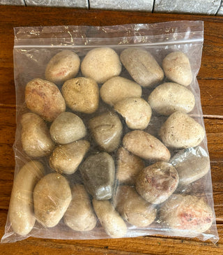 Decorative pebbles for styling plant pots, covering soil surfaces, and enhancing indoor plant displays.
